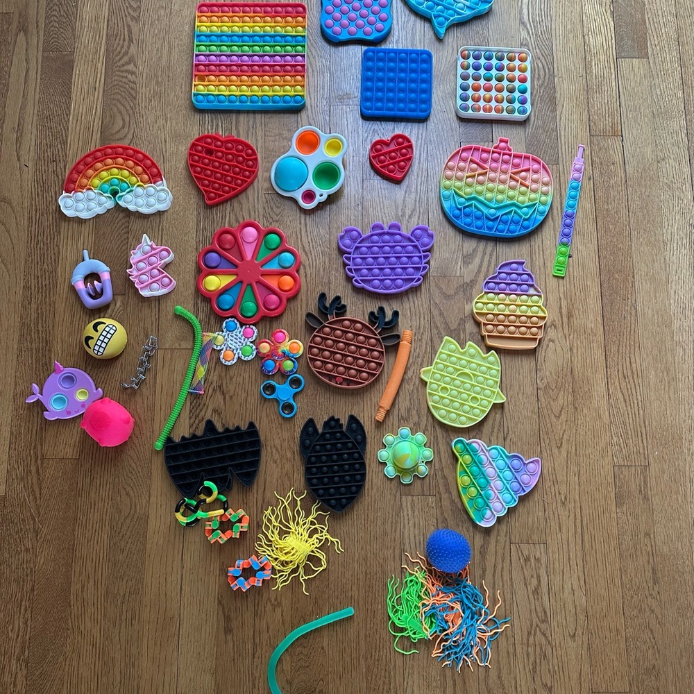 Lot of brand new fidget toys all shapes sizes and colors